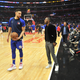 Agent Rich Paul talks to his client Ben Simmons during halftime of a basketball game between the Los Angeles Clippers and the Philadelphia 76ers at Staples Center on January 01, 2019 in Los Angeles, California.